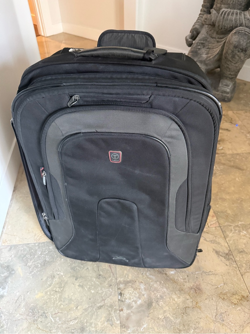 Tumi Black and Gray Rolling Carry-On